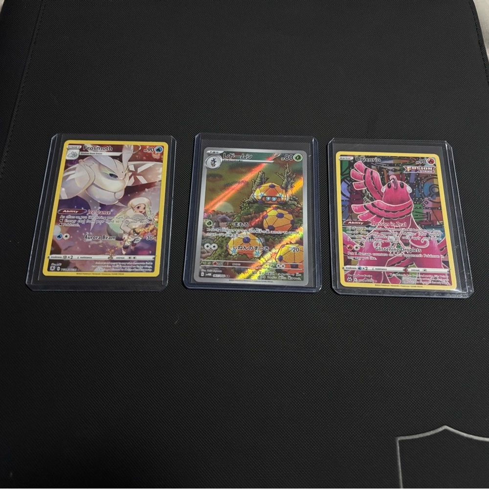 Set of Three Pokémon Cards.